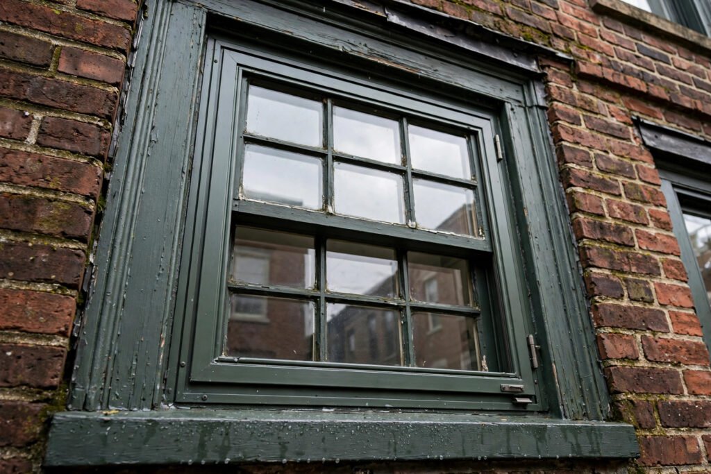 Storm window fitted to a historic window